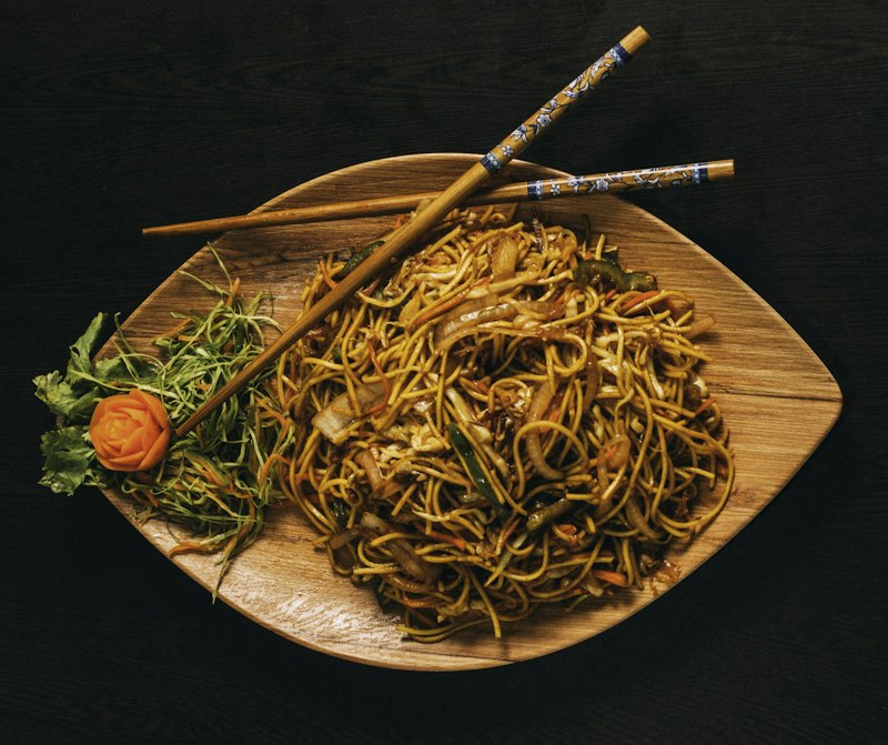 Wok-fried noodles with chopsticks